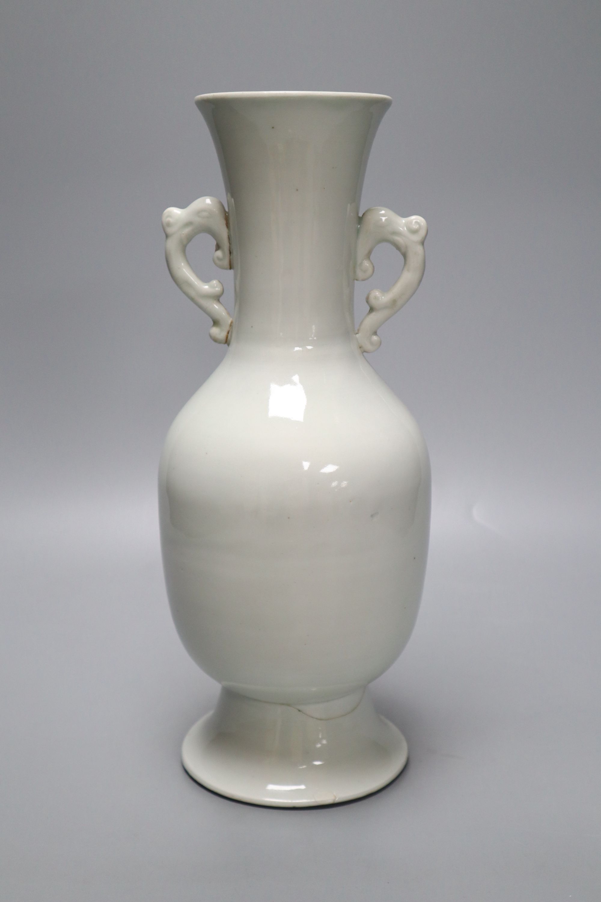 A Chinese white glazed porcelain two handled vase, height 29cm (a.f.)